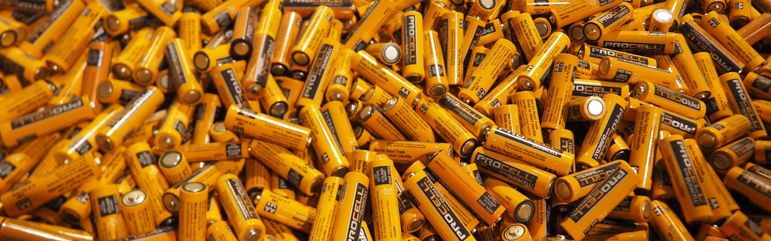 A picture of a large bin of all AA alkaline batteries. NLR recycles alkaline batteries and all other battery types.